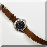 J112. Swiss Army watch with brown leather band. - $68